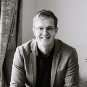 Black and white image of Adam Tozer